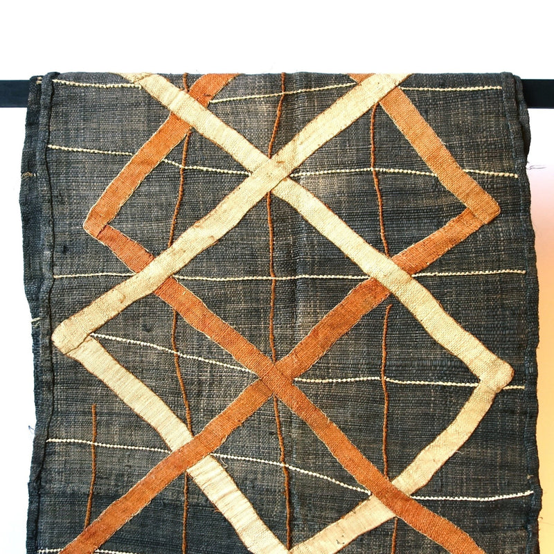 Denim colored cloth with brown and cream criss cross pattern