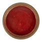 Red pedestal shaped offering basket with gold trim, top view