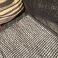 Handwoven cotton and leather rug, close up